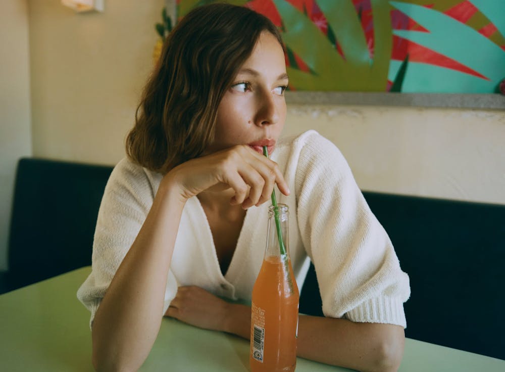 a woman sitting at a table